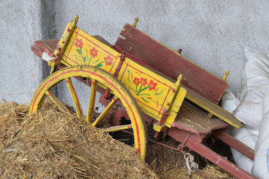 Old Sicilian chariot abandoned on straw