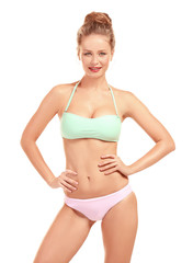 Fototapeta premium Beautiful young woman in swimsuit on white background