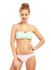 Obraz premium Beautiful young woman in swimsuit on white background