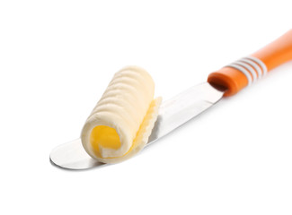 Delicious butter curl on shovel isolated on white, closeup