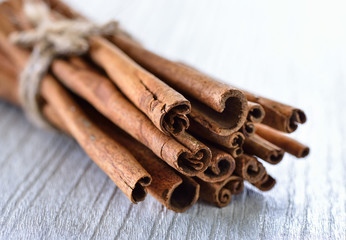 Cinnamon on white wood