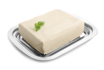 Dish with butter on white background