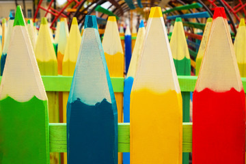 Creative colorful fence outdoors, closeup