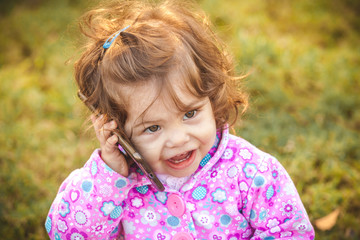 Fototapeta premium baby with mobile in park 