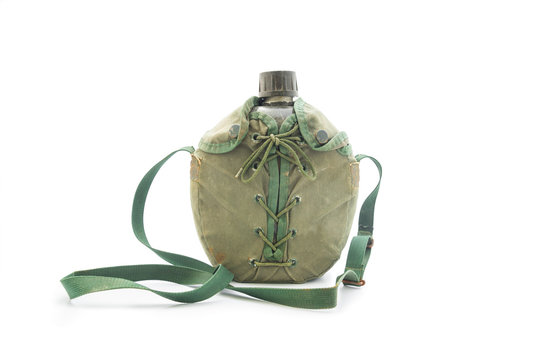 World war army water canteen with dirty green cover on a white background