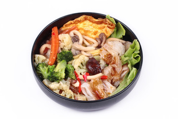 Fried big noodle  with omelet topped mixed vegetable in soup.