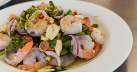 mixing seafood salad