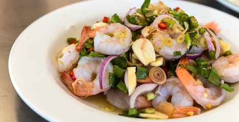 mixing seafood salad