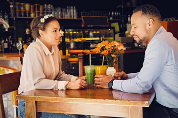 A man and a woman in a cafe.