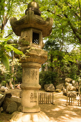 A small stone pagoda in zen garden, Japan