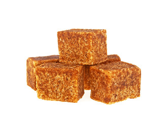 Brown sugar cubes isolated on a white background