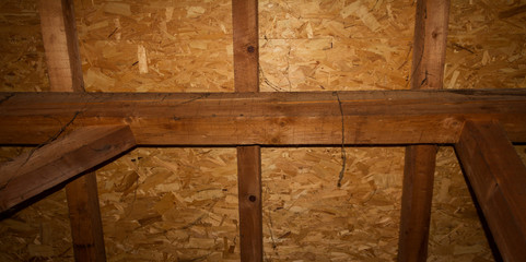 Wooden ceiling in the attic of the house