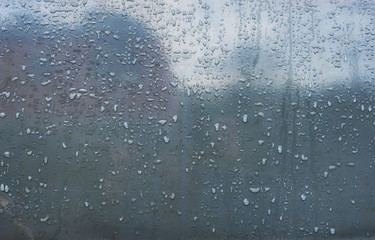 water drops on metallic surface close up