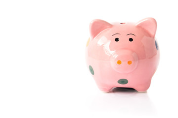 Pink ceramic piggy bank on white background