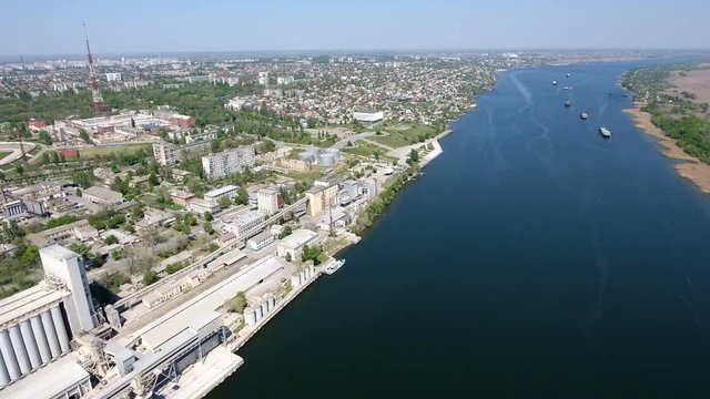 Astonishing view on the Dnipro river quay in Kherson with a lot of modern buildings. The sparkling blue waters of the river impress with their beauty and greatness. The skyscape looks splendid 