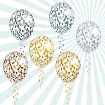 Transparent Golden and silver balloons with spangles, confetti and streamers