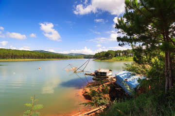 Fototapeta na wymiar Fishing net in Tuyen Lam lake in Dalat, Lam Dong, Vietnam. Tuyen Lam lake is artificial lake, 6km to the South of Dalat, has the water surface of 350 hectare.