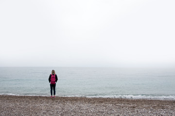 Alone girl stay near sea