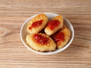 Chicken nuggets with sesame seeds on a plate