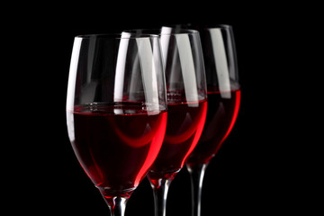 Three wineglasses isolated on black