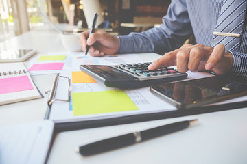 Business concept. Business people discussing the charts and graphs showing the results of their successful teamwork.