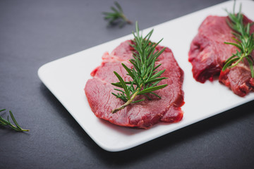 Raw beef meat sliced on a plate