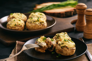 Baked mushroom caps stuffed with creams cheese, garlic and herbs.