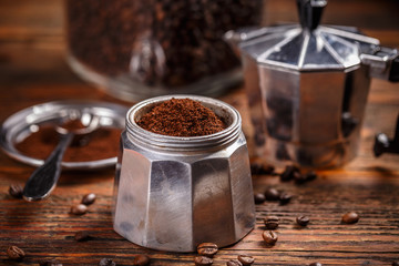 Ground coffee and moka pot