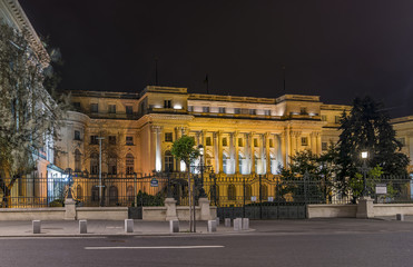 Fototapeta na wymiar Beautiful night view of The Royal Palace known as Palace of the Republic on Calea Victoriei street, historic center of Bucharest, Romania
