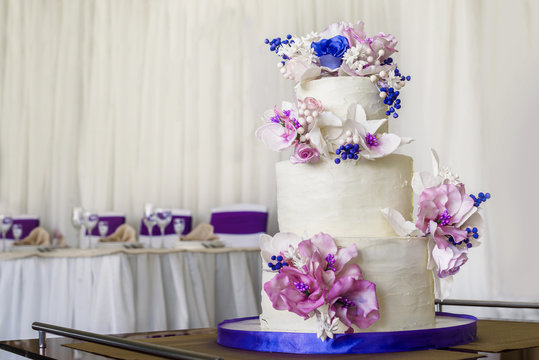 Wedding classic three tiered cake in banquet hall