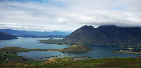 Naklejka premium Landscape with lake and cloudy sky, New Zealand