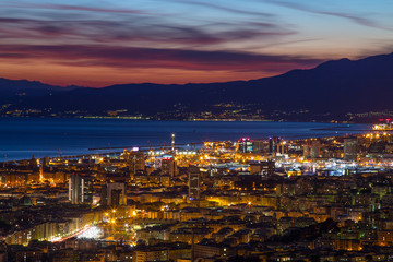 Obraz premium GENOA (GENOVA), ITALY, MARCH 10, 2017 - Aerial view of the city of Genoa (Genova) at dusk.