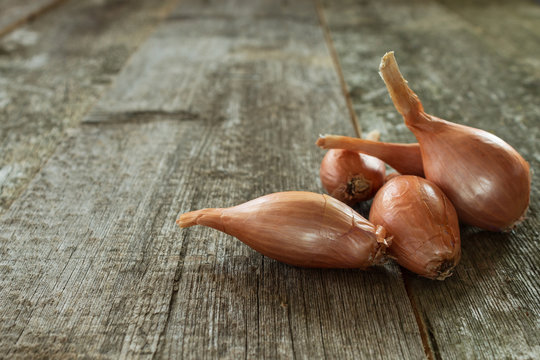 Shallot onion on a wooden background