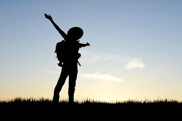 Happy hiker in silhouette