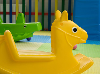 plastic toy horse-chairs and crocodile