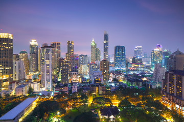 Fototapeta premium Aerial view of Bangkok modern office buildings, condominium in Bangkok city downtown with sunset sky ,Bangkok is the most populated city in Southeast Asia. Bangkok , Thailand