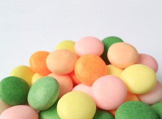 Pile of Closed Up Multi-Colored Round Candies with Selective Focus 
