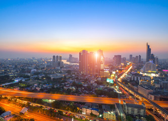 Fototapeta na wymiar Aerial view of Bangkok modern office buildings, condominium, living place in Bangkok city downtown with sunset scenery, Bangkok , Thailand