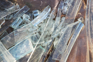 Vandals smashed the glass windows of the unfinished unguarded abandoned building of the shopping...