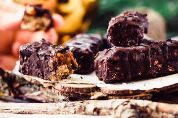 Homemade raw chocolate candy snickers bars. Tone.