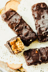 Homemade raw chocolate candy snickers bars. Vegan dessert.