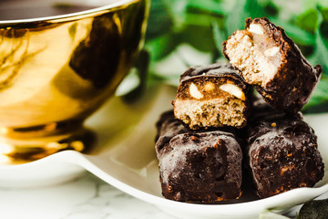 Homemade raw chocolate candy snickers bars. Vegan dessert.