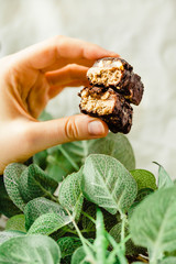 Homemade raw chocolate candy. Snickers bars with cup of coffee.