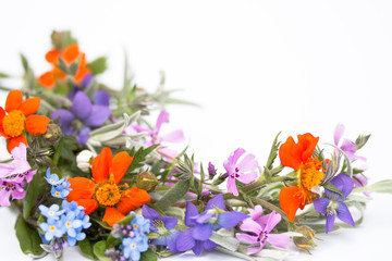 Fototapeta na wymiar bright pretty dainty spring wreath of multicolored flowers