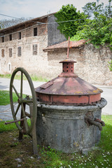 Fototapeta na wymiar Old well covered with hand pump.