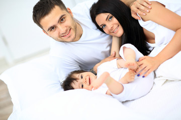 family with young children to bed in the bedroom