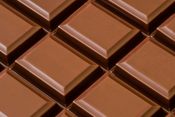 Pieces of dark chocolate. Macro shoot. Selective focus.