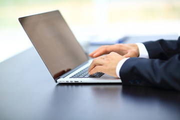 Person Typing on a modern laptop