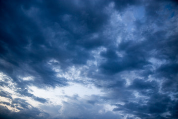 Beautiful clouds at sunset after rain as background .