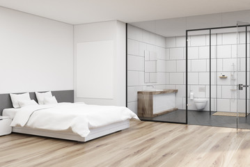 Bedroom with white bathroom, corner